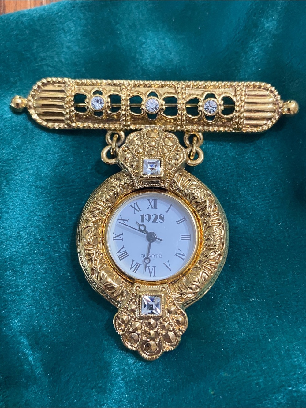 1928 Gold-Tone Filigree Nurse Fob Watch Brooch with Clear Stones